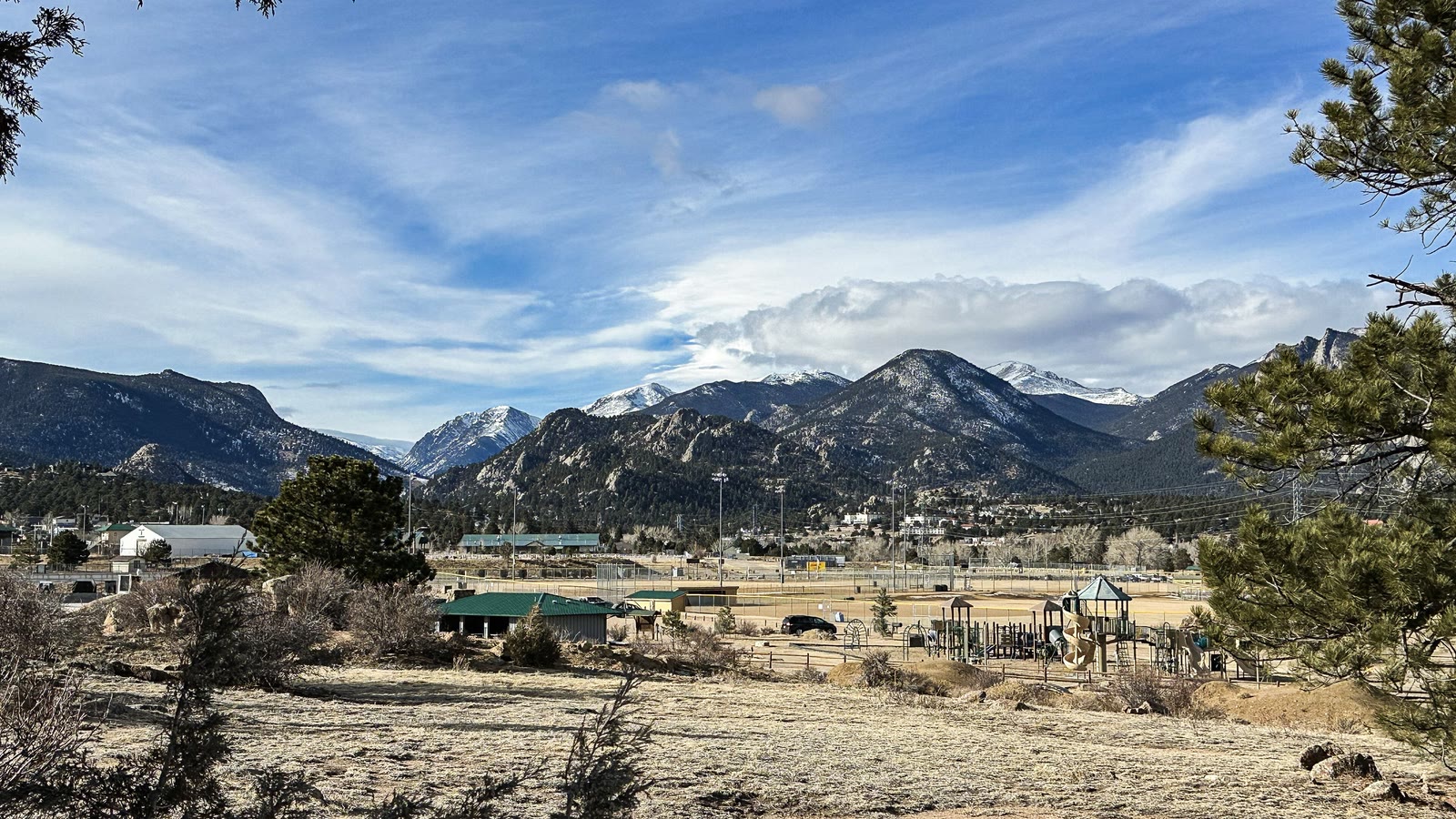 The Rocky Mountain National Park peaks above Estes Park, Colorado