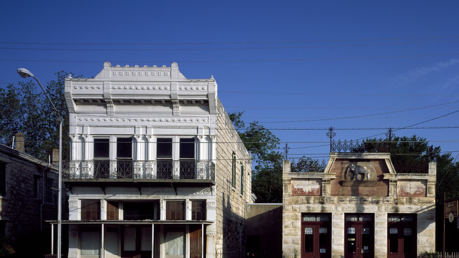 Historic limestone storefronts on Main Street in Fredericksburg, Texas